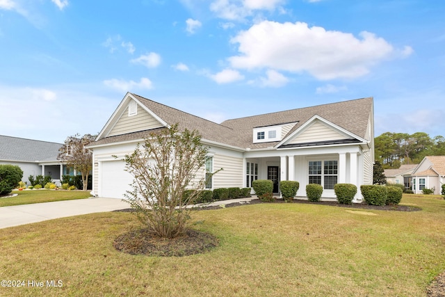 view of front of home featuring a garage and a front lawn