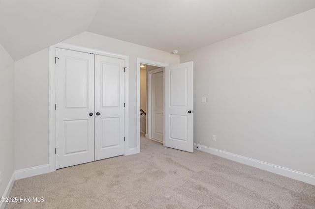 bonus room with baseboards, carpet floors, lofted ceiling, and visible vents
