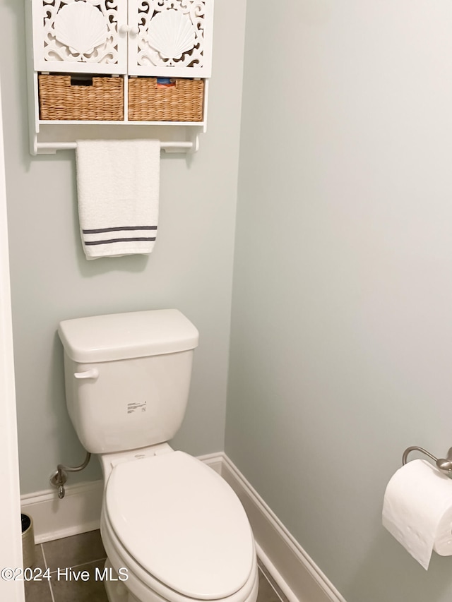 bathroom with tile patterned floors and toilet