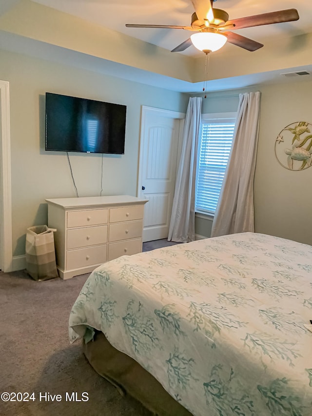 carpeted bedroom with ceiling fan