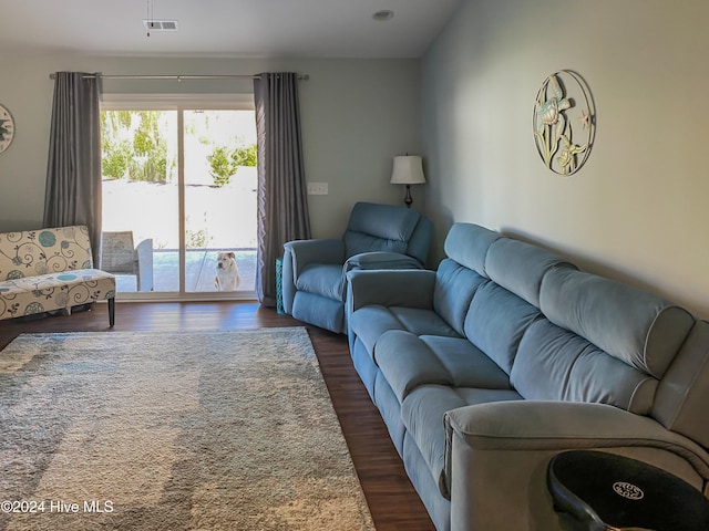 living room featuring dark wood-type flooring