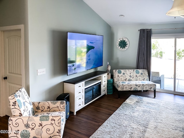 living area featuring dark hardwood / wood-style flooring and vaulted ceiling