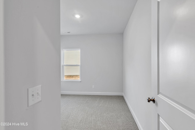 unfurnished room with carpet flooring