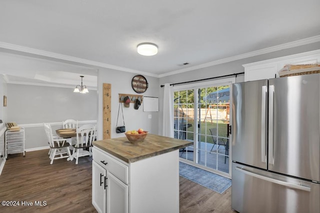 kitchen with white cabinets, stainless steel refrigerator, and dark wood-type flooring