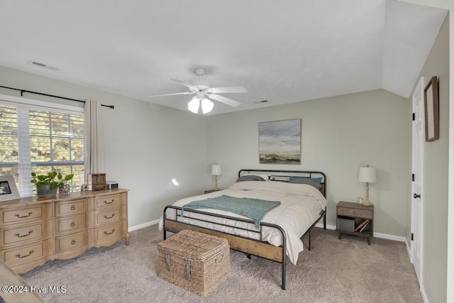 bedroom with light carpet, ceiling fan, and vaulted ceiling