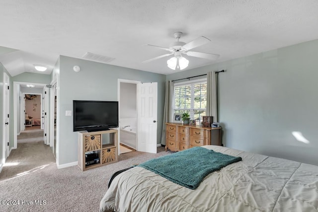 carpeted bedroom with lofted ceiling, ceiling fan, and ensuite bathroom