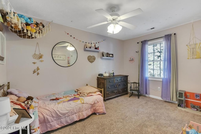 carpeted bedroom with ceiling fan