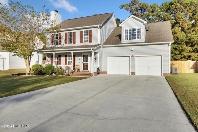 colonial house with a front lawn, a garage, cooling unit, and covered porch