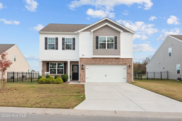 view of front facade with a garage and a front yard