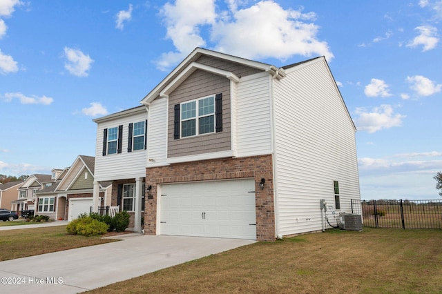 view of front of home featuring central AC unit, a garage, and a front yard