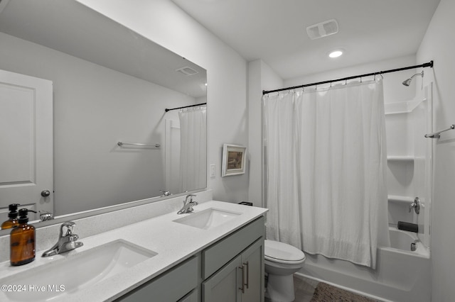 full bathroom with toilet, vanity, and shower / bath combo with shower curtain