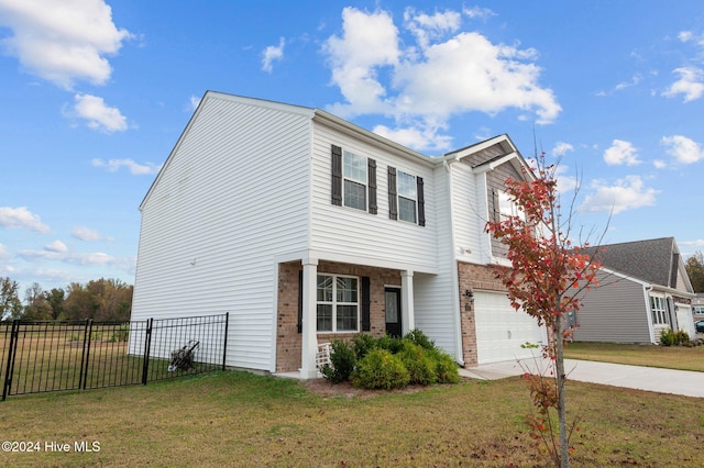 view of front of house with a front lawn and a garage