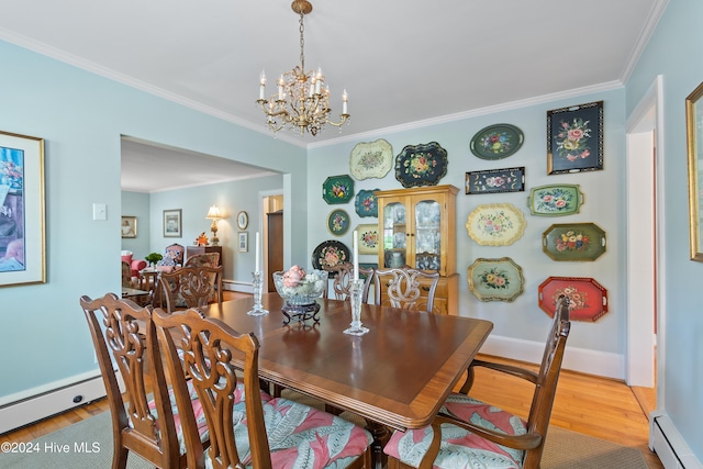 dining area with hardwood / wood-style flooring, baseboard heating, and ornamental molding