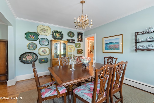 dining space with ornamental molding, baseboard heating, wood-type flooring, and a chandelier