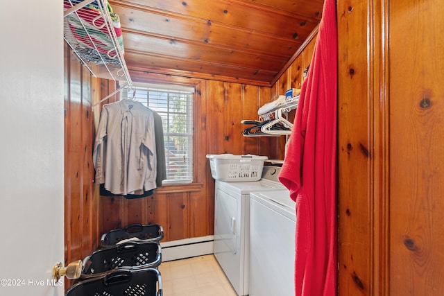 washroom featuring wood walls, wooden ceiling, separate washer and dryer, and a baseboard radiator