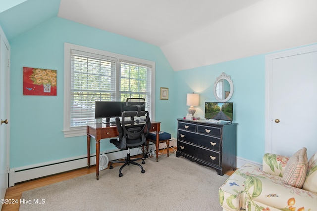 home office featuring baseboard heating, light wood-type flooring, and lofted ceiling