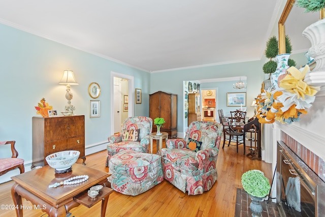 living room featuring hardwood / wood-style floors, baseboard heating, a brick fireplace, and ornamental molding