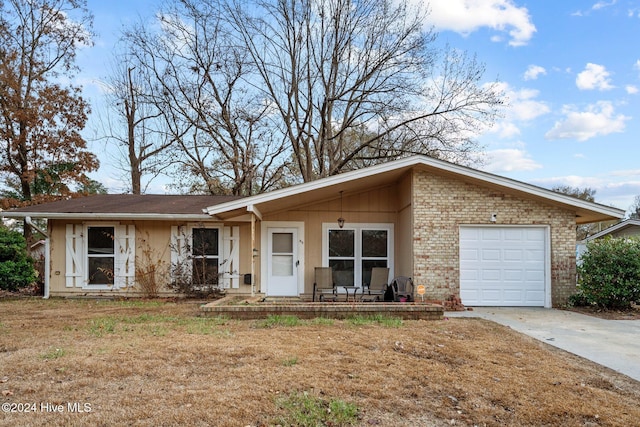 single story home featuring a garage