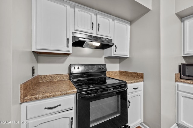 kitchen with white cabinets and black electric range oven