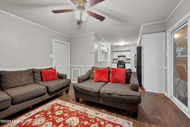 living room featuring crown molding, dark hardwood / wood-style flooring, ceiling fan, and a textured ceiling