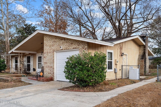 view of side of home featuring a garage