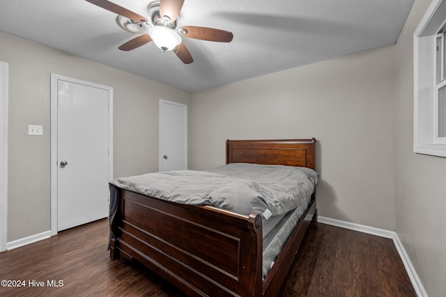 bedroom featuring a textured ceiling, dark hardwood / wood-style flooring, and ceiling fan