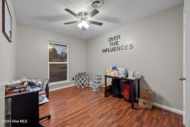 office featuring ceiling fan, dark hardwood / wood-style flooring, and a textured ceiling