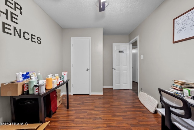 office featuring a textured ceiling and dark hardwood / wood-style floors