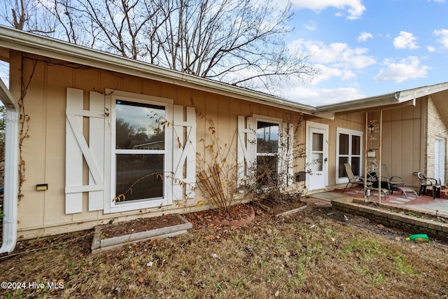 doorway to property with a patio