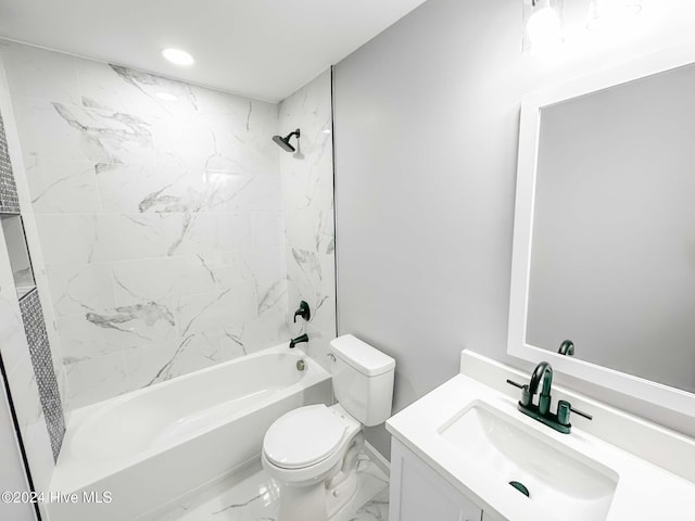 full bathroom with vanity, tiled shower / bath, and toilet