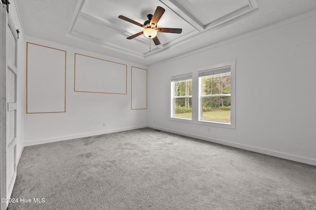 unfurnished room with ornamental molding, coffered ceiling, ceiling fan, beam ceiling, and carpet floors