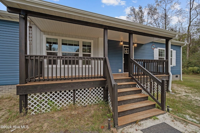 doorway to property featuring covered porch