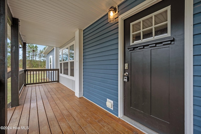 wooden deck featuring covered porch