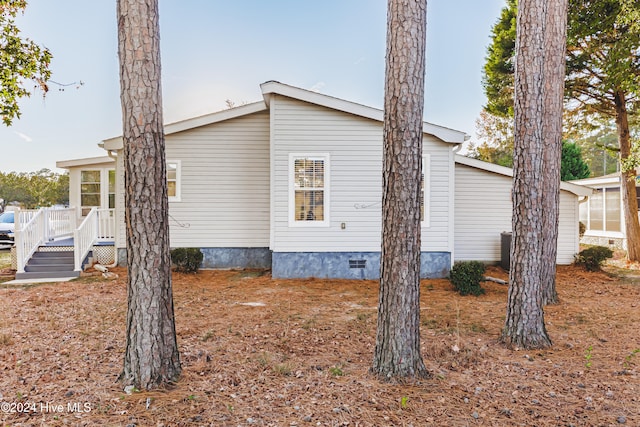 view of side of home with a deck