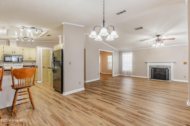 kitchen with black appliances, ornamental molding, and light hardwood / wood-style flooring