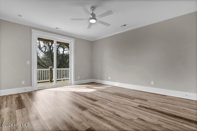 unfurnished room featuring ceiling fan, light hardwood / wood-style flooring, and ornamental molding