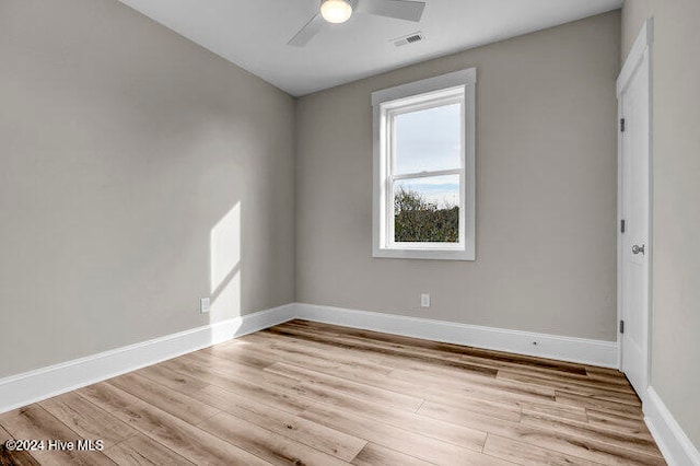 spare room featuring ceiling fan and light wood-type flooring