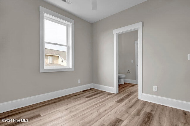 empty room with light hardwood / wood-style floors