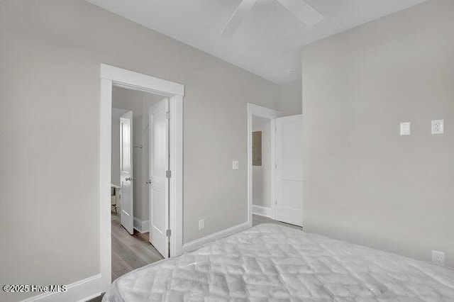 unfurnished bedroom featuring a ceiling fan and baseboards