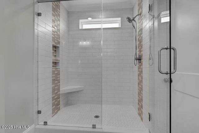 bathroom with a shower stall