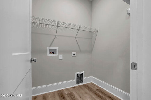 laundry room with washer hookup, hardwood / wood-style flooring, and electric dryer hookup