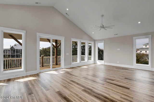 unfurnished living room featuring ceiling fan, high vaulted ceiling, and light hardwood / wood-style flooring