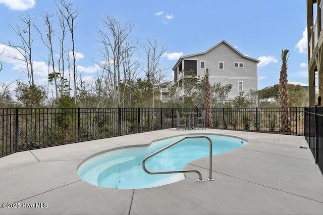 view of swimming pool featuring a fenced in pool, a patio, and a fenced backyard