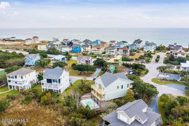 birds eye view of property with a residential view and a water view