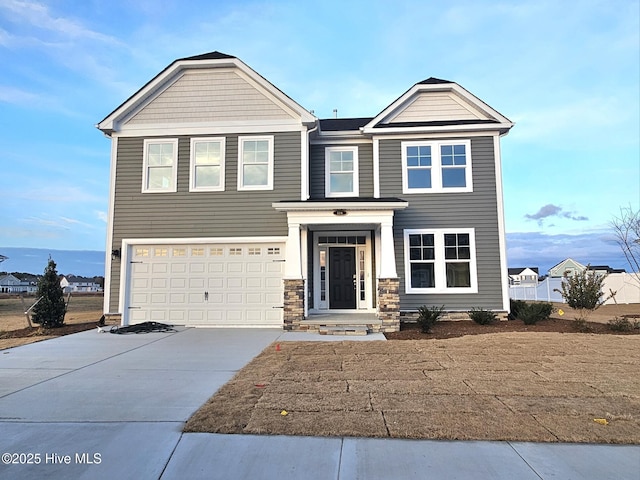 118 Arbormoor Ln, Moyock, NC 27958 - craftsman-style house with concrete driveway, a garage, and stone siding