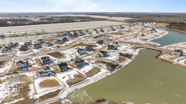 birds eye view of property with a water view and a residential view