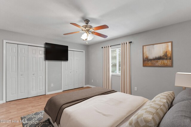 utility room featuring electric panel and water heater