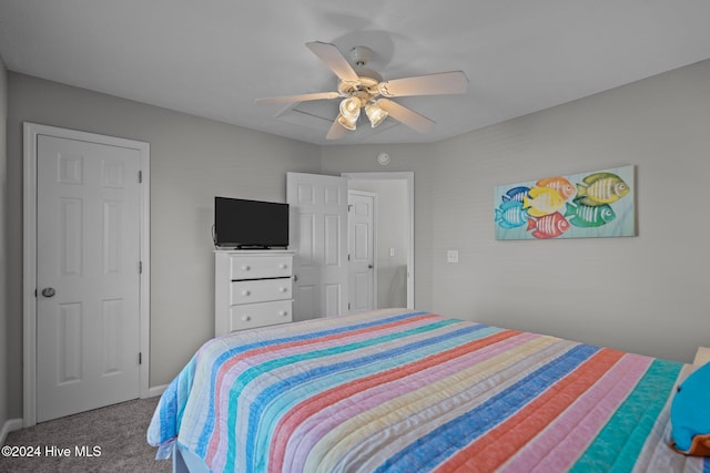 carpeted bedroom with a ceiling fan