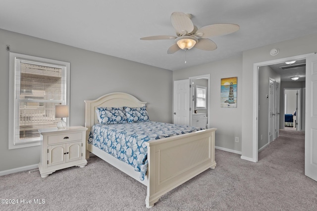 bedroom with light carpet, a ceiling fan, and baseboards