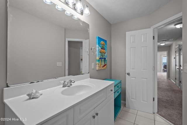 bathroom featuring tile patterned floors, visible vents, and vanity